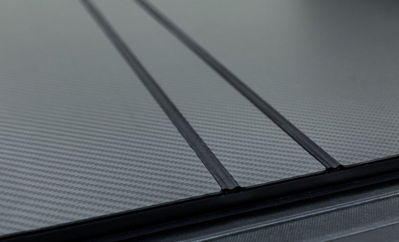 Access LOMAX Tri-Fold Cover 04-14 Ford F-150 6ft 6in Bed - Carbon Fiber Finish