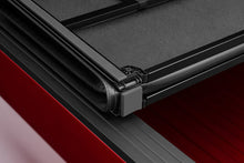 Load image into Gallery viewer, Lund 05-15 Toyota Tacoma Fleetside (5ft. Bed) Hard Fold Tonneau Cover - Black