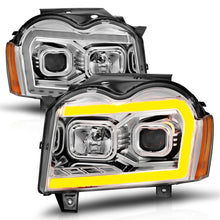 Load image into Gallery viewer, ANZO 05-07 Jeep Grand Cherokee Projector Headlights - w/ Light Bar Switchback Chrome Housing