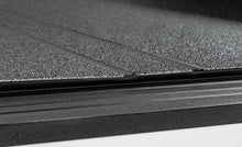 Load image into Gallery viewer, Access LOMAX Tri-Fold Cover Black Urethane 19+ Dodge Ram - 5ft 7in Bed (Except Classic - w/ RamBox) AJ-USA, Inc