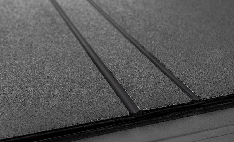 Access LOMAX Tri-Fold Cover Black Urethane Finish 16-20 Toyota Tacoma - 5ft Bed (w/o OEM Hard Cover) AJ-USA, Inc